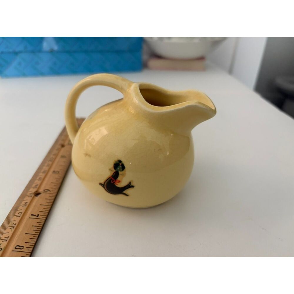 VTG. Wall pottery yellow ball pitcher with Seal